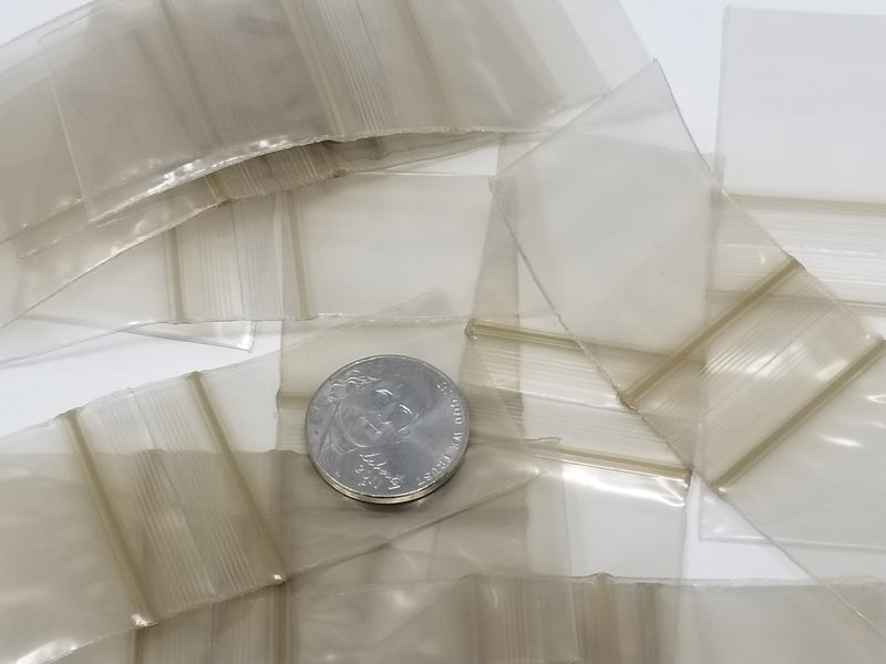 Gold resealable bags from Original Apple Bags, 1.25 x 1.25 inches, ideal for packaging small items or gifts.