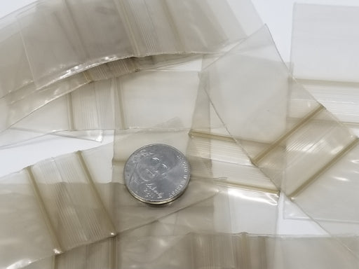 Gold resealable bags from Original Apple Bags, 1.25 x 1.25 inches, ideal for packaging small items or gifts.