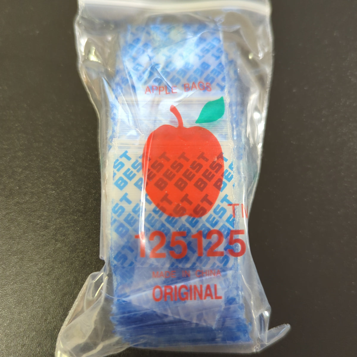 Blue Original Apple Bags, 1.25 x 1.25 inches, showcasing the small, high-quality packaging for apples or produce.