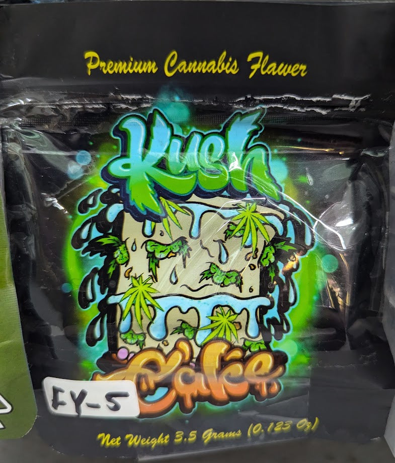 Smell-proof Kush Cake Mylar bags by The Baggie Store, 50-pack, shown with sealed, durable silver storage bags for cannabis or snacks.