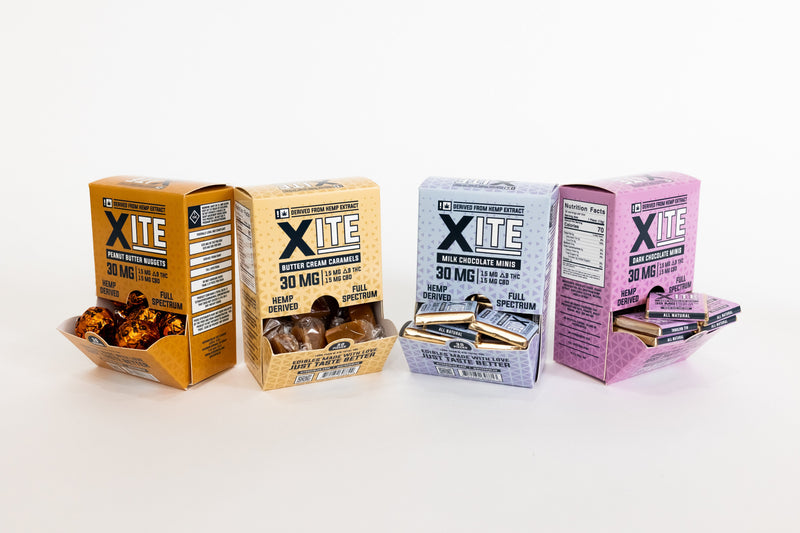Xite Chocolate Edibles 30mg, close-up of the chocolate bar with a smooth, rich texture and packaging in the background.