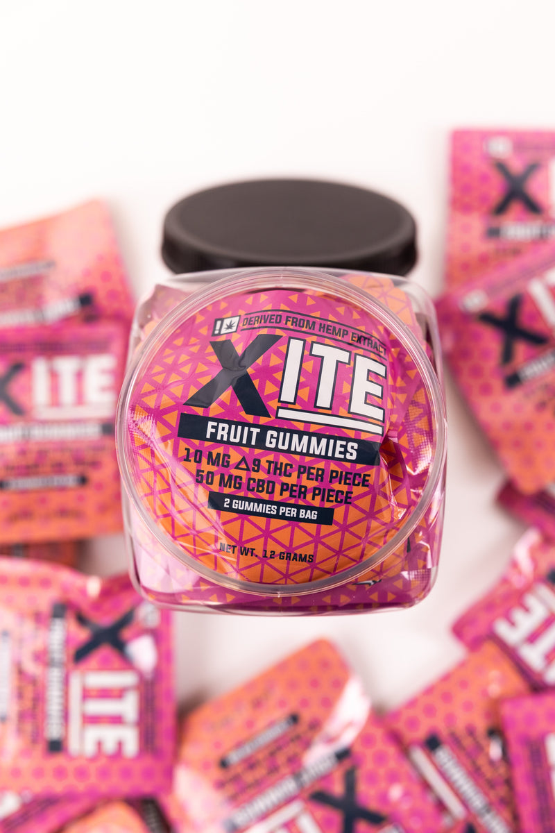 Xcite 2-pack D9 fruit gummies in colorful, assorted shapes and flavors, showcasing the chewy, vibrant candies.
