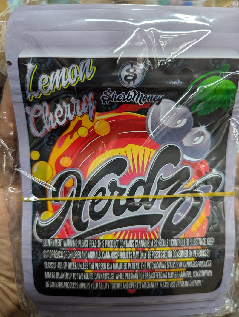 Smell-proof Lemon Cherry Nerdz candies in a pack of 50 bags, featuring colorful packaging and branding from The Baggie Store.