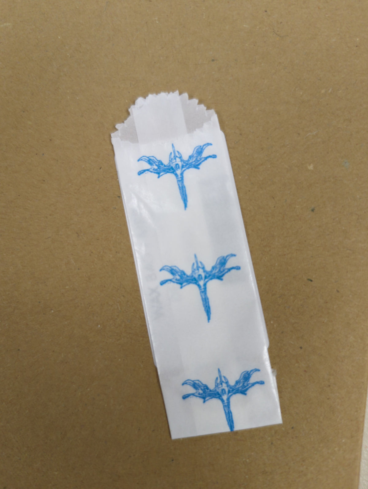Vellum glassine stamp wax paper envelope bags with bird design, moisture-resistant wax bags for stamps and collectibles.