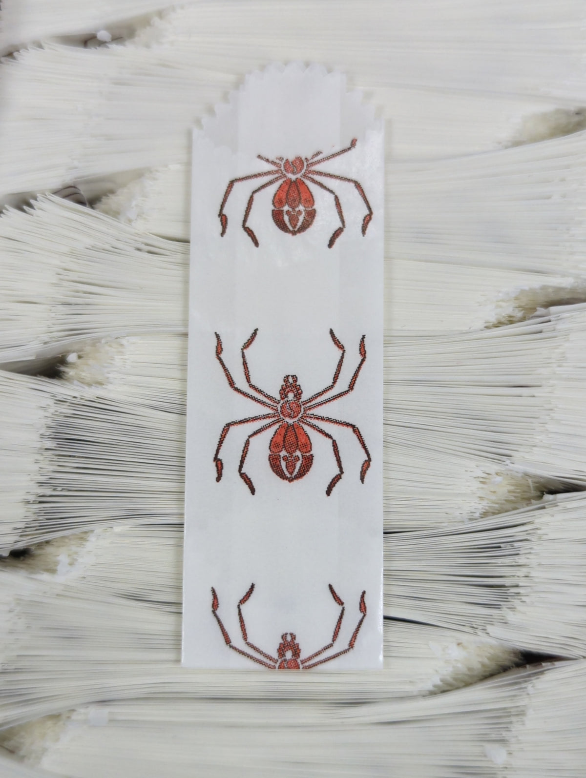 Vellum Glassine Stamp Wax Paper Envelope Bags with spider design, moisture-resistant wax bags for stamp storage.