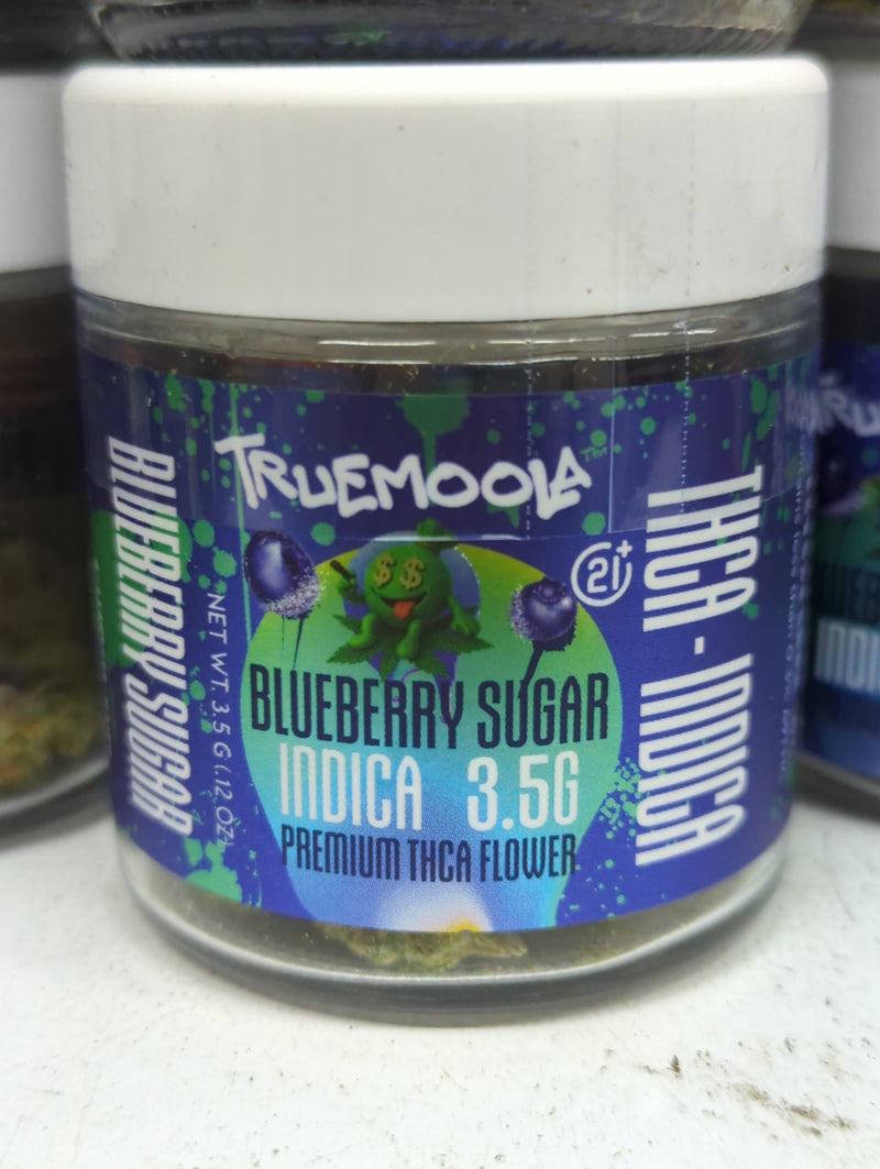 Premium indoor flower THC-A by The Baggie Store, Truemoola, 3.5g, showing vibrant buds with dense green and purple hues.