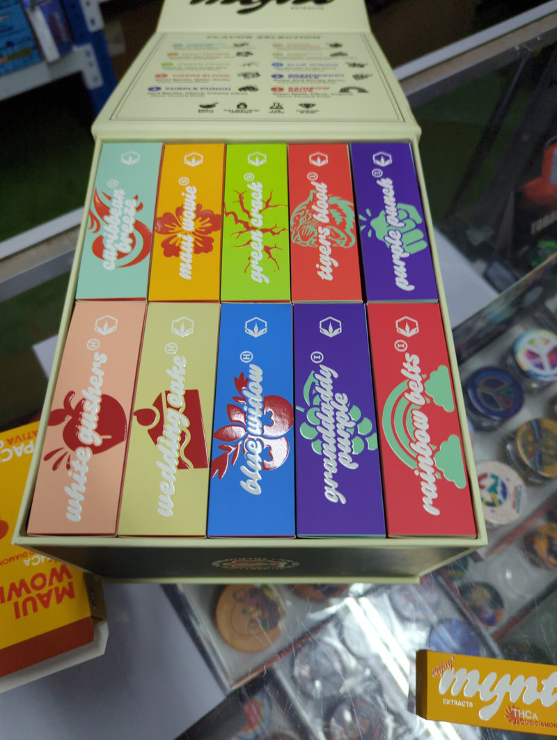 Box of Mynt extracts by The Baggie Store with colorful packaging featuring various flavors and branding on top.