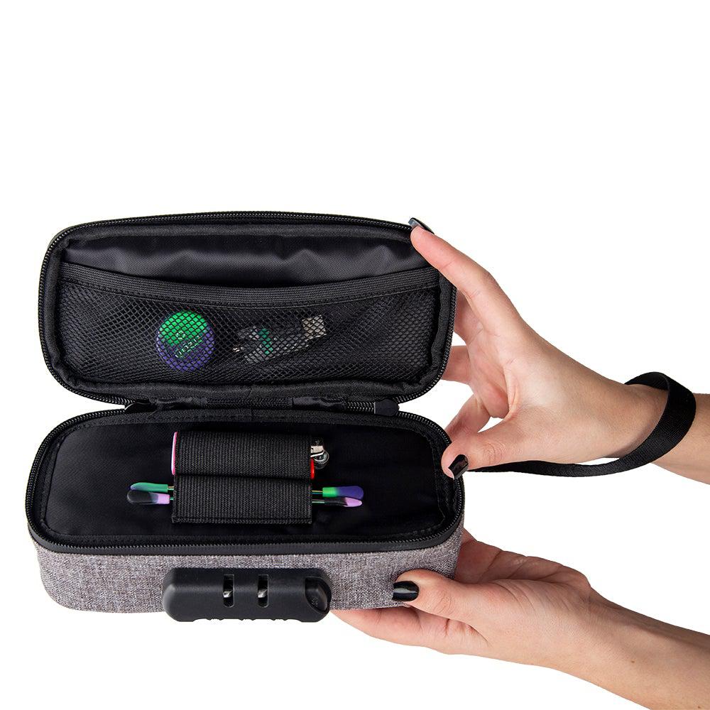 Ooze Traveler smell-proof travel pouch in smoke gray, compact apparel case with secure zipper closure and sleek design.