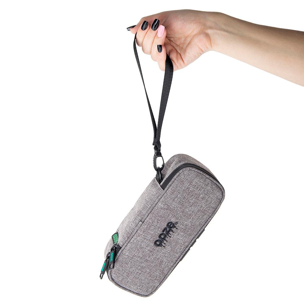 Ooze Traveler smell-proof travel pouch in smoke gray, compact and secure for storing small accessories or personal items.