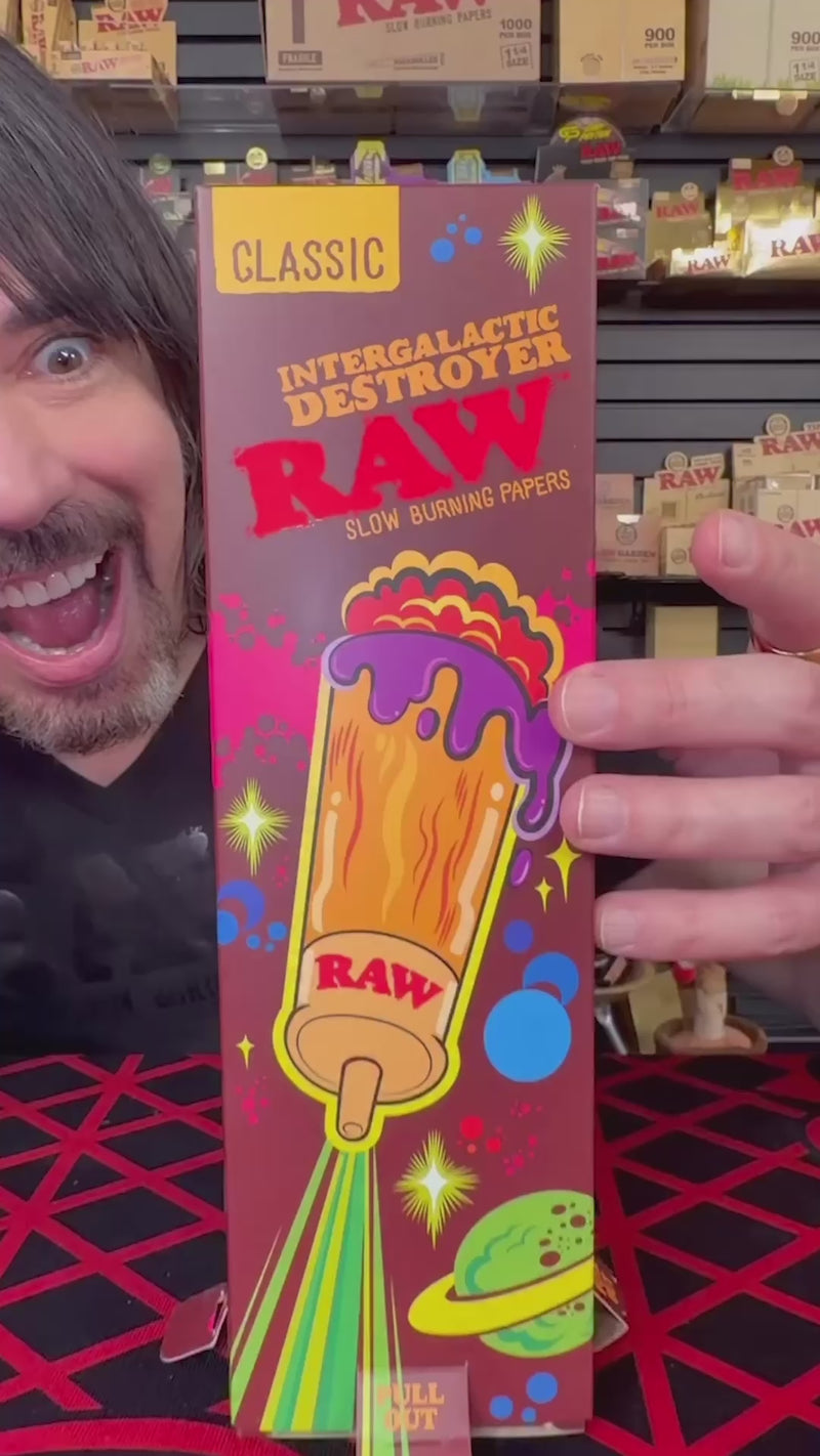 RAW Intergalactic Destroyer Tube cones for rolling, featuring the RAW brand logo and space-themed design on natural rolling paper cones.