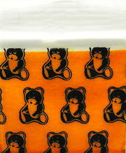 Teddy bear inside a clear SIZE 1212 Original Apple Bag by The Baggie Store, measuring 1/2" x 1/2" with a transparent design.