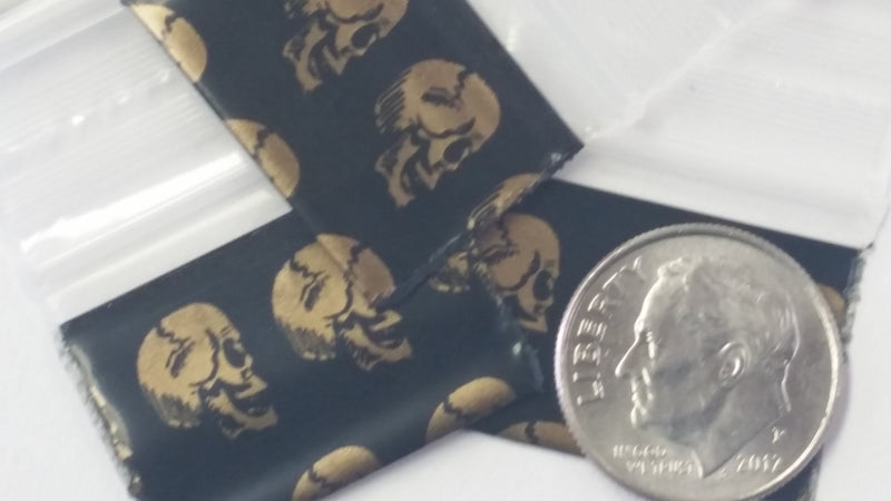 1034 Original Mini Ziplock 2.5mil Plastic Bags 1" x 3/4" Reclosable Baggies (Gold Skulls) - The Baggie Store