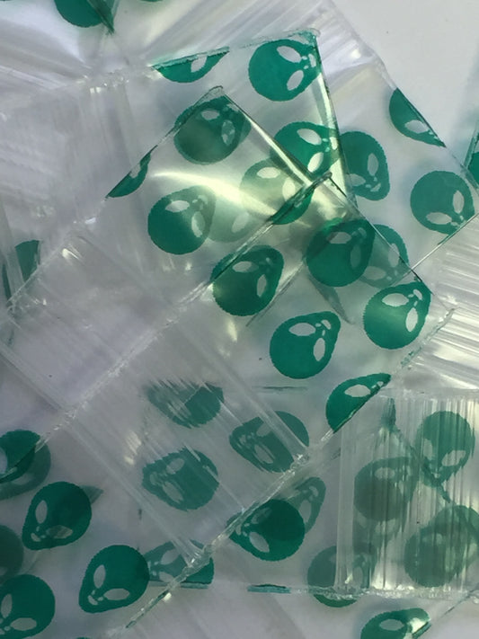 Resealable 1212 Original Apple Bags in alien design, measuring 1/2 inch by 1/2 inch, for secure storage and packaging.