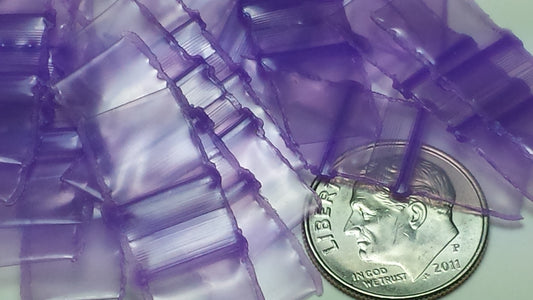 Purple 3/8" x 3/8" resealable bags from Original Apple Bags, flexible plastic storage solution.