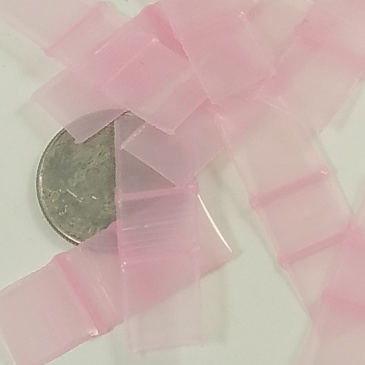 Pink 3/8" x 3/8" resealable bags from Original Apple Bags, perfect for packaging small items or crafts.