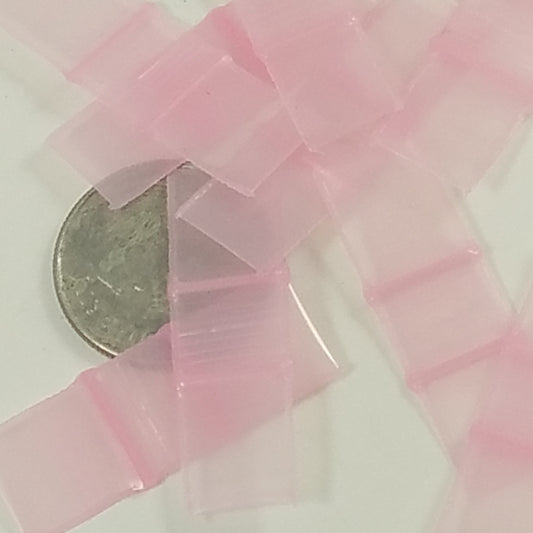 Pink 3/8" x 3/8" resealable bags from Original Apple Bags, perfect for packaging small items or crafts.
