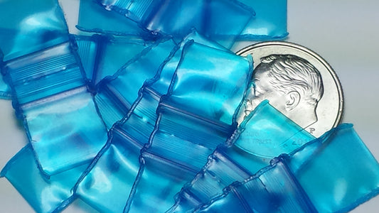 Blue 3/8" x 3/8" resealable bags from Original Apple Bags, perfect for storing small items or packaging.