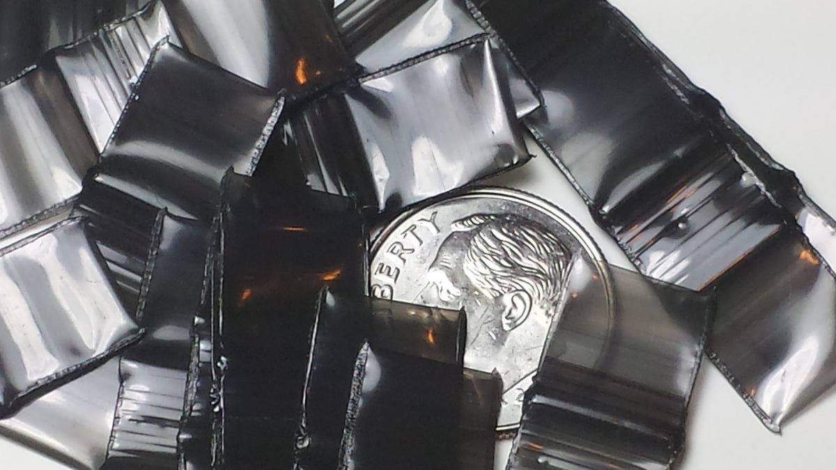 Black 3/8" x 3/8" resealable bags by Original Apple Bags, showcasing their durable, airtight design for secure storage.