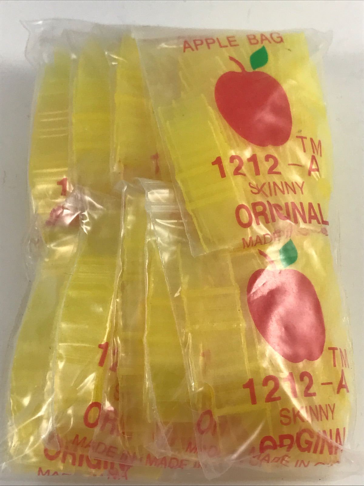 Yellow resealable bags from Original Apple Bags, 1/2" x 1/2" size, designed for secure storage and packaging.