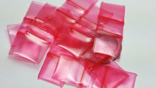 Red 1/2" x 1/2" resealable bags from Original Apple Bags, made of durable material for secure storage.