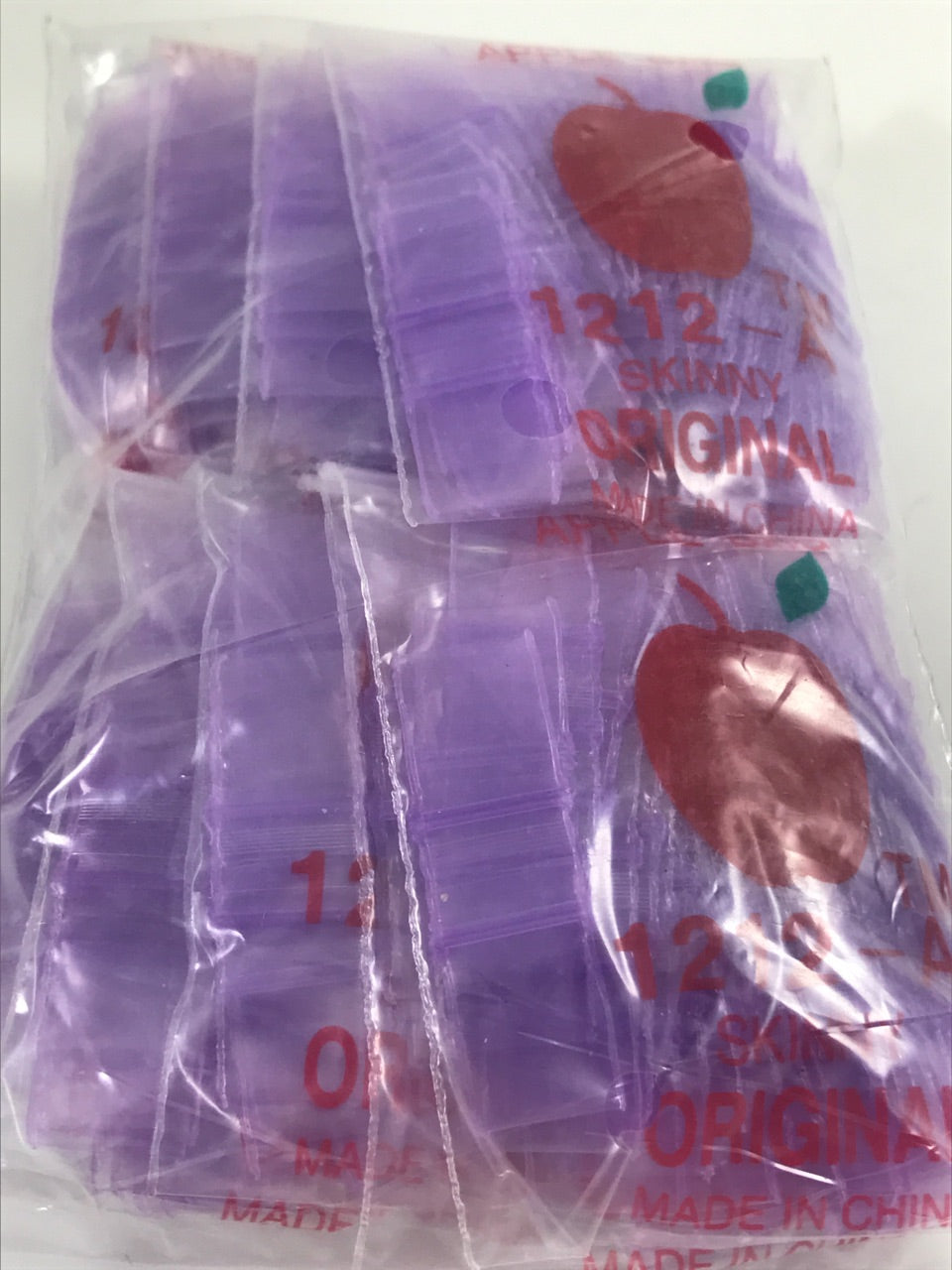 Purple resealable bags by Original Apple Bags, 1/2 inch by 1/2 inch, perfect for storing small items or crafts.