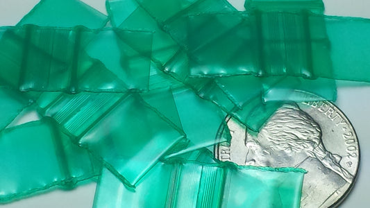 Green resealable bags by Original Apple Bags, 1/2 inch by 1/2 inch, perfect for storing small items or snacks.