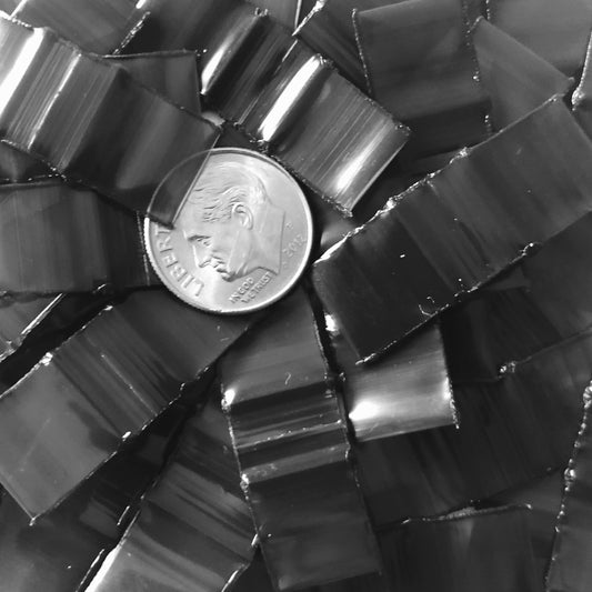 Black resealable Apple Bags, 1/2" x 1/2", by Original Apple Bags, shown in a clear image with the bags folded and ready for use.
