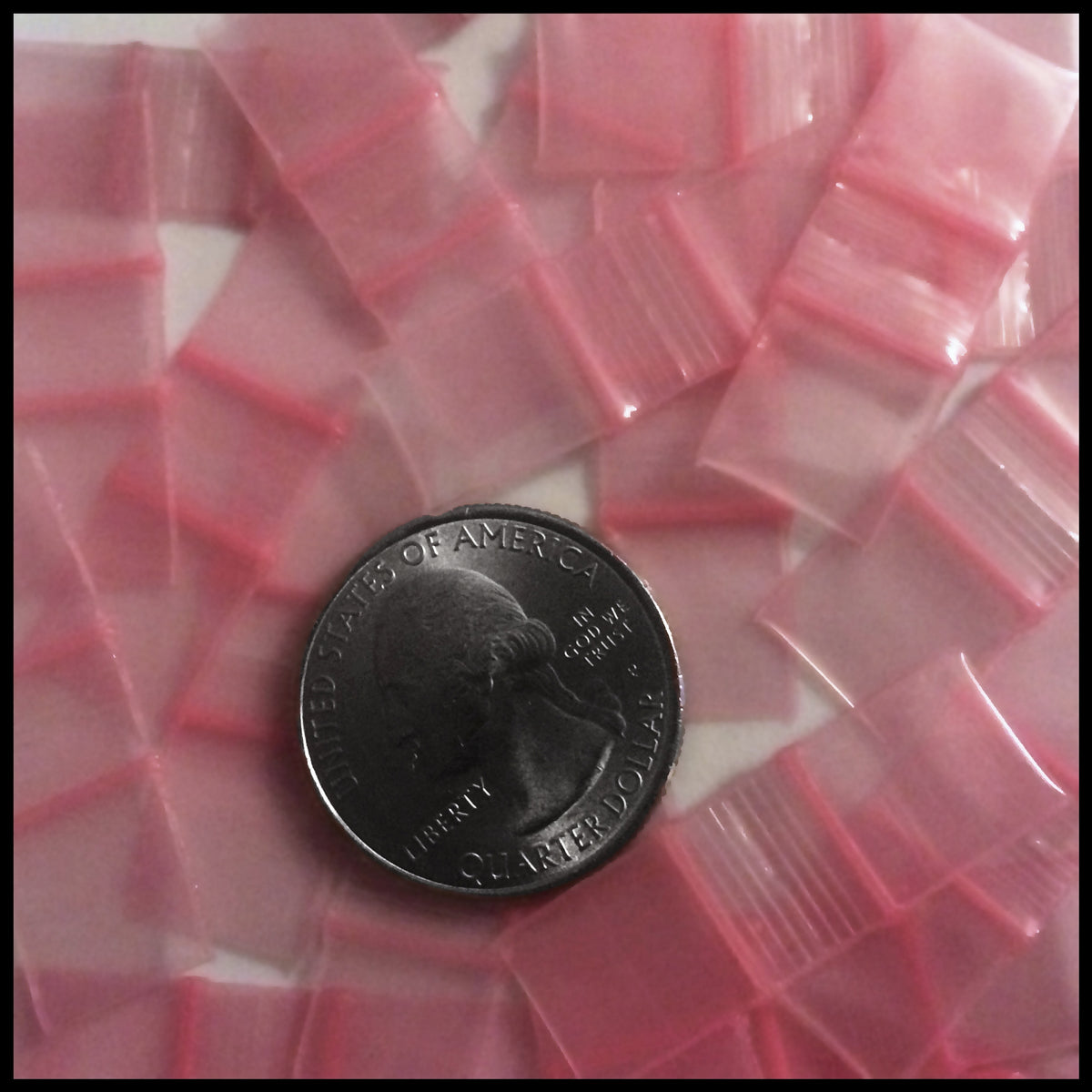 Pink resealable storage bags from Original Apple Bags, 1/2 inch by 1/2 inch, ideal for organizing small items.
