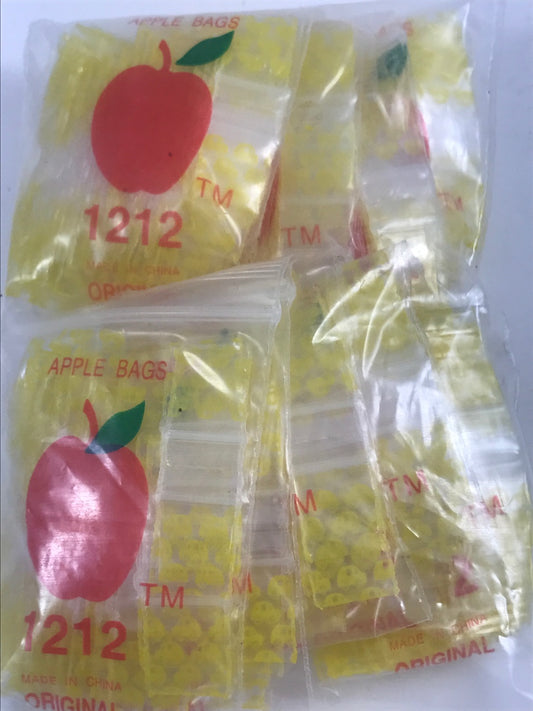 Resealable Original Apple Bags in taxi cab yellow, 1/2 inch by 1/2 inch, designed for secure storage and packaging.