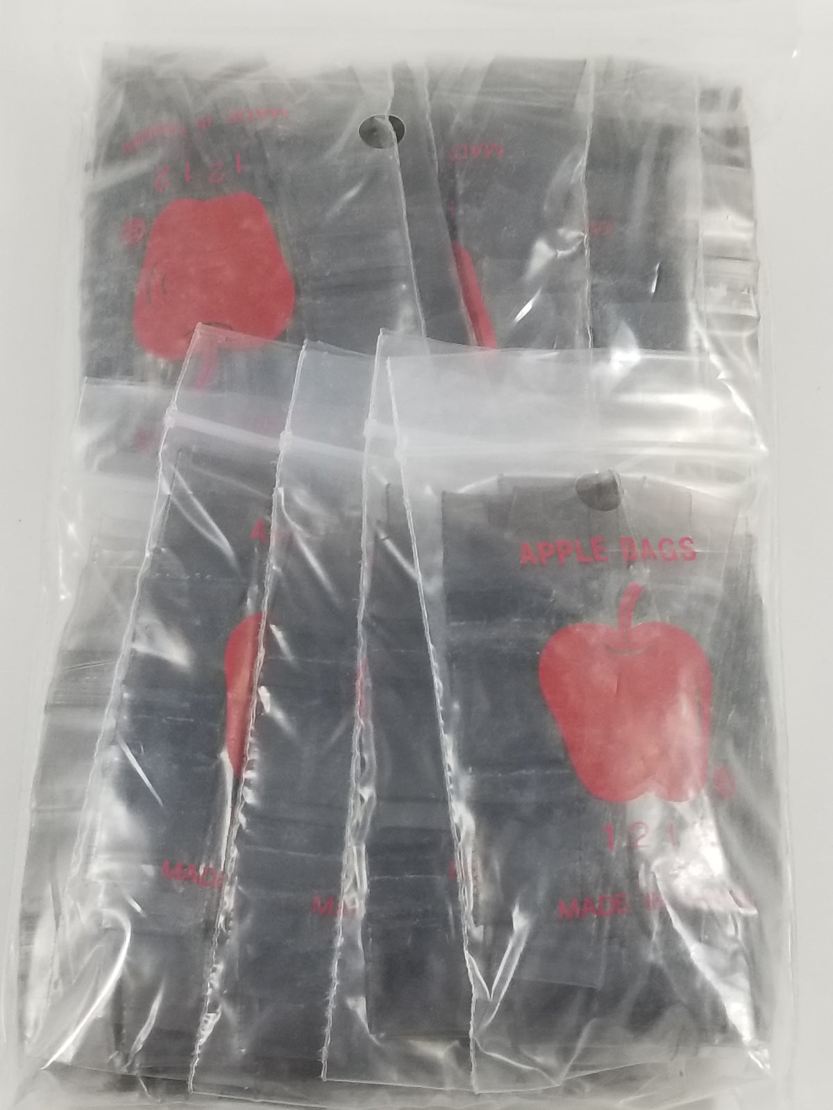 Black 1/2" x 1/2" resealable bags by Original Apple Bags, shown with a focus on the resealable closure and compact size.