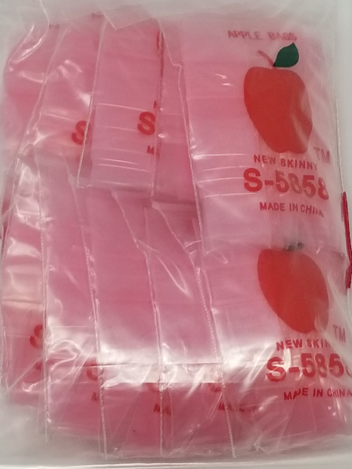 Pink resealable bags from Original Apple Bags, 5/8 inch by 5/8 inch size, perfect for storage or packaging.