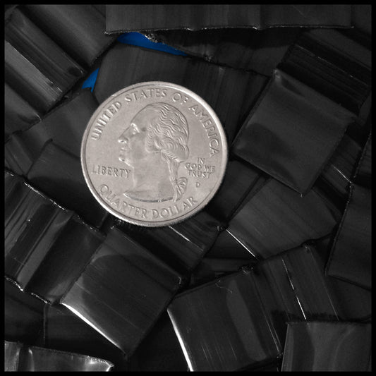 Black resealable bags by Original Apple Bags, 5/8 inch by 5/8 inch, shown with a clear view of the small, durable plastic bags.