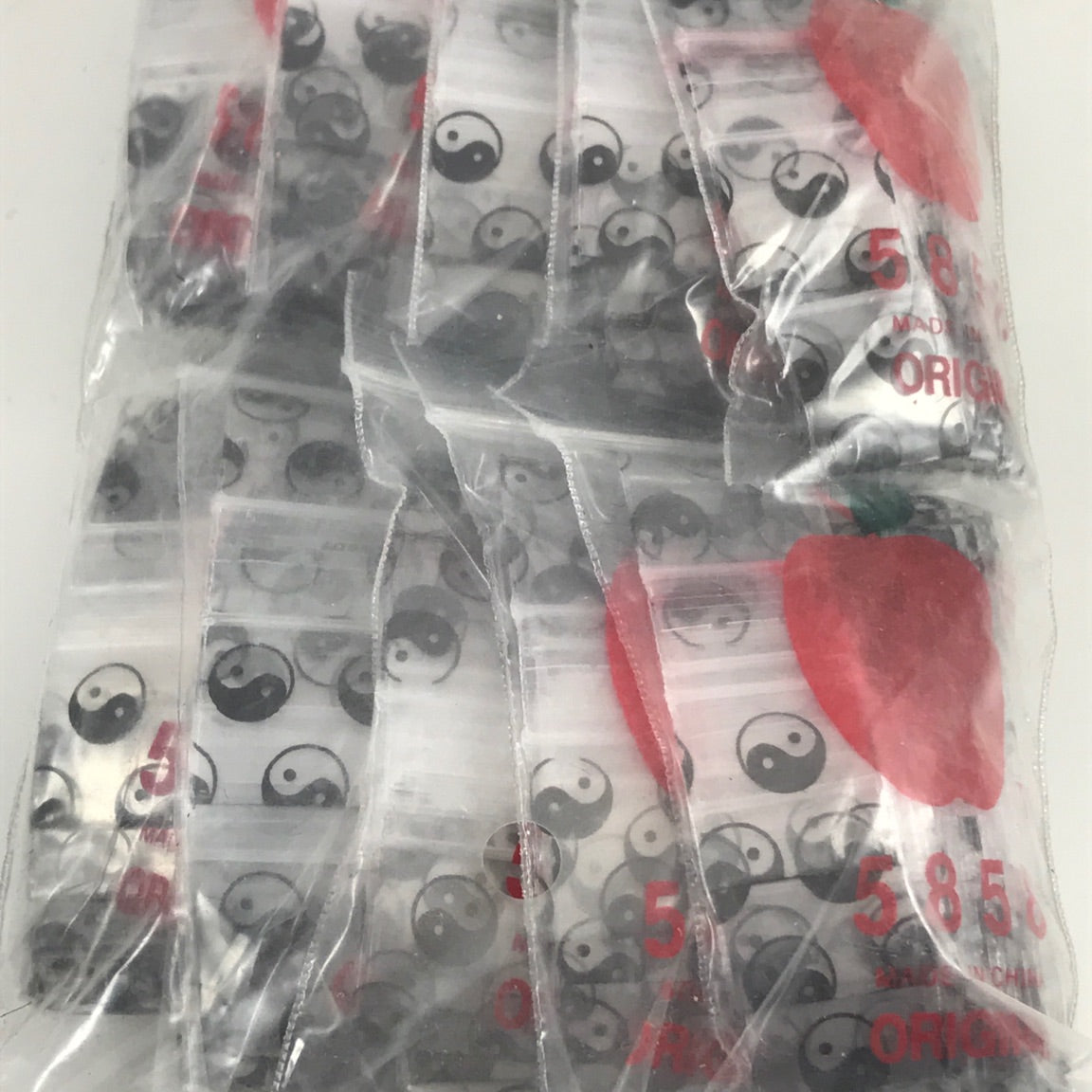 Original Apple Bags resealable bags with Taiiji/Yin Yang design, 5/8" x 5/8" size, featuring the iconic apple logo and pattern.