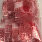 Red dice design resealable bags from Original Apple Bags, 5/8 inch by 5/8 inch size, ideal for storage and organization.