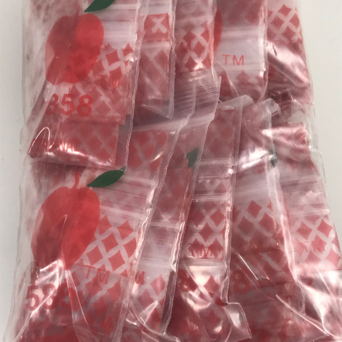 Resealable Original Apple Bags with diamond pattern, 5/8" x 5/8" size, designed for storing small items or crafts.