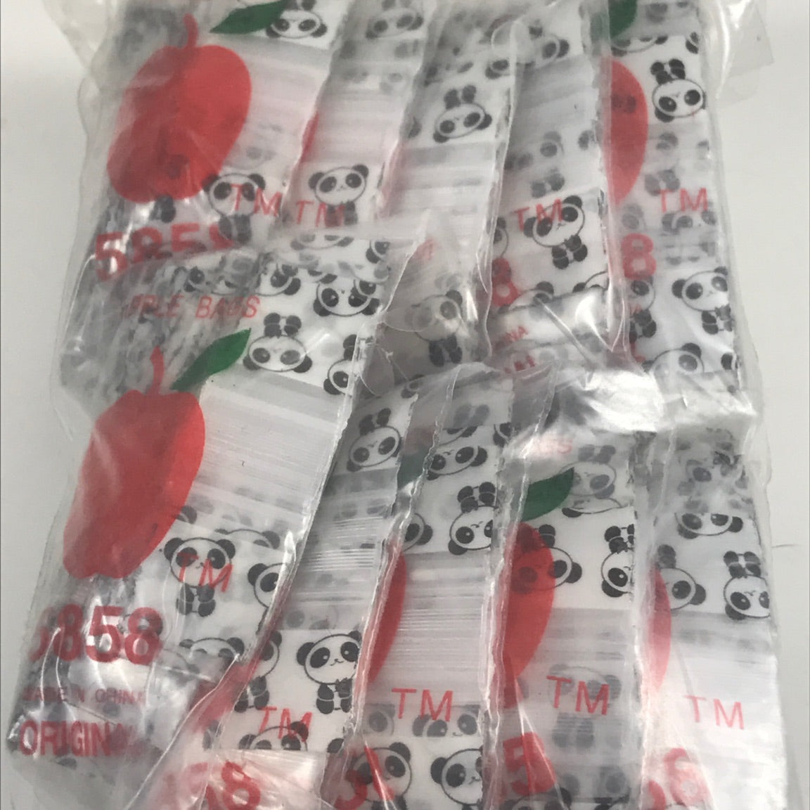Original Apple Bags 5/8" x 5/8" resealable bags with panda design, ideal for storing small items or gifts.