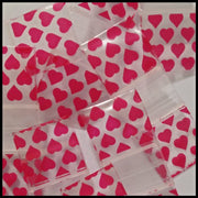 Resealable 5/8" x 5/8" Original Apple Bags with heart design, ideal for packaging small items or gifts.