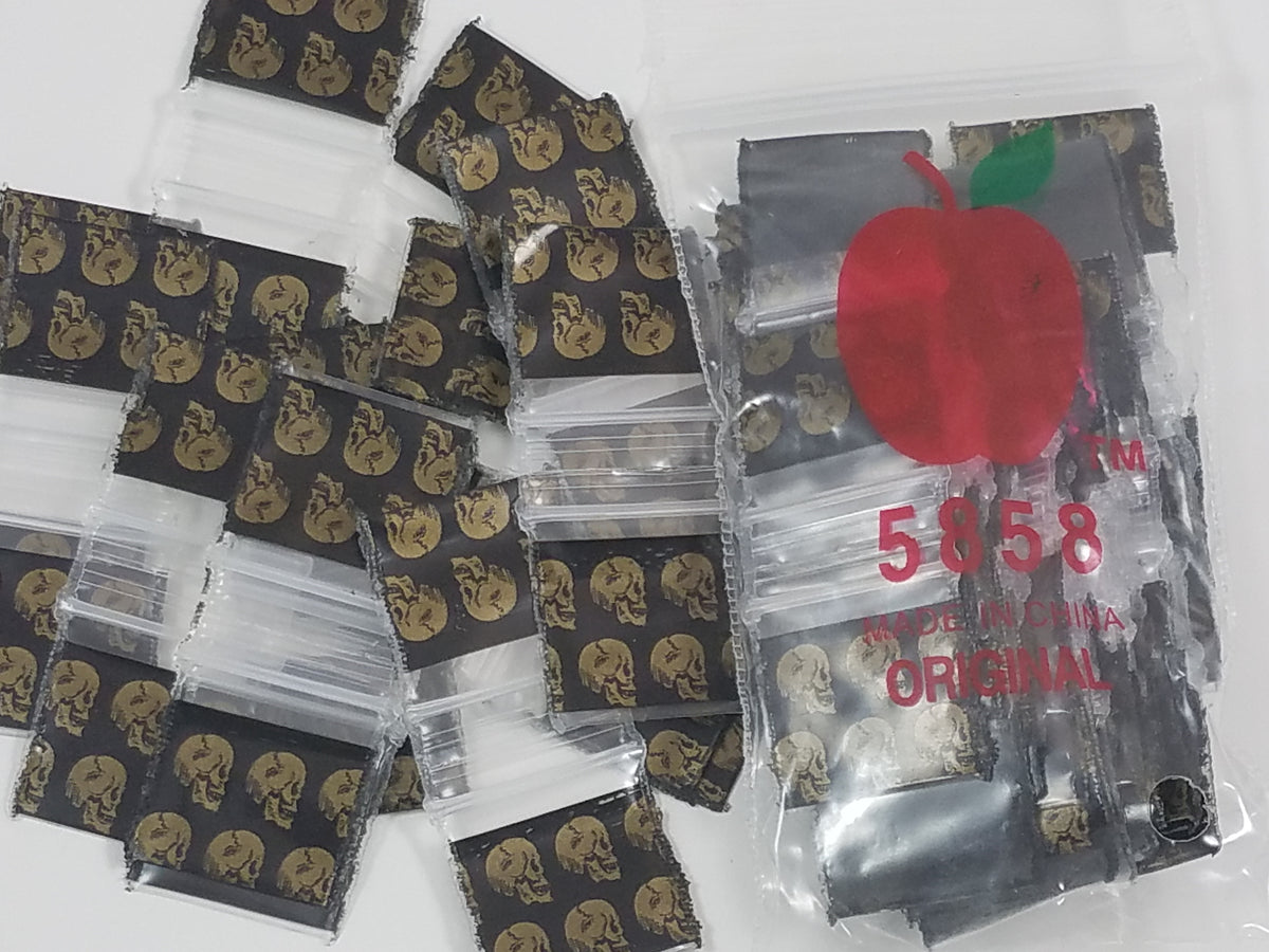 Resealable gold skull design Apple Bags, 5/8 inch by 5/8 inch, ideal for packaging small items or gifts.