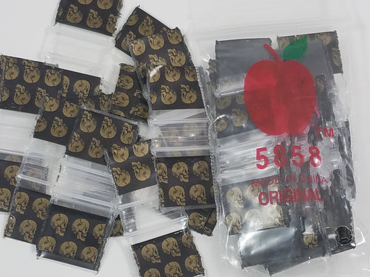 Resealable gold skull design Apple Bags, 5/8 inch by 5/8 inch, ideal for packaging small items or gifts.