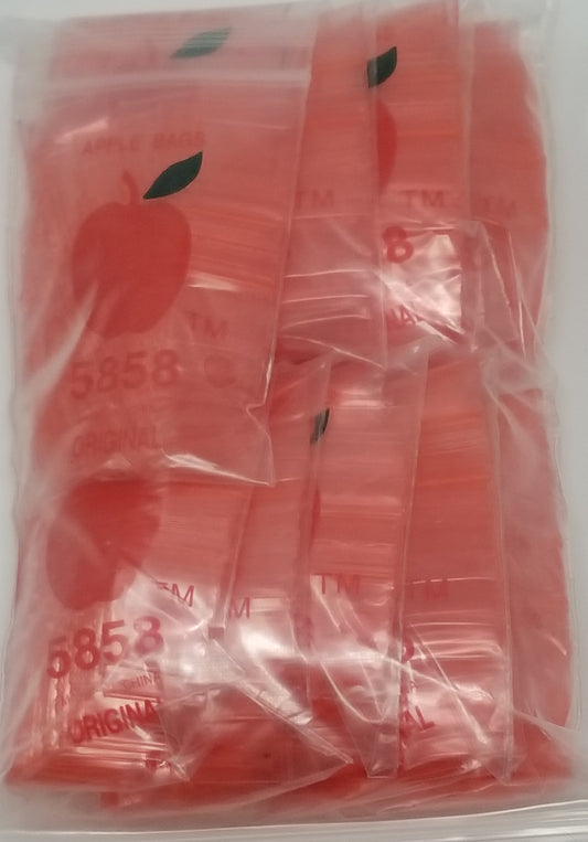 Red resealable bags by Original Apple Bags, 5/8 inch by 5/8 inch, ideal for storing small items or packaging.