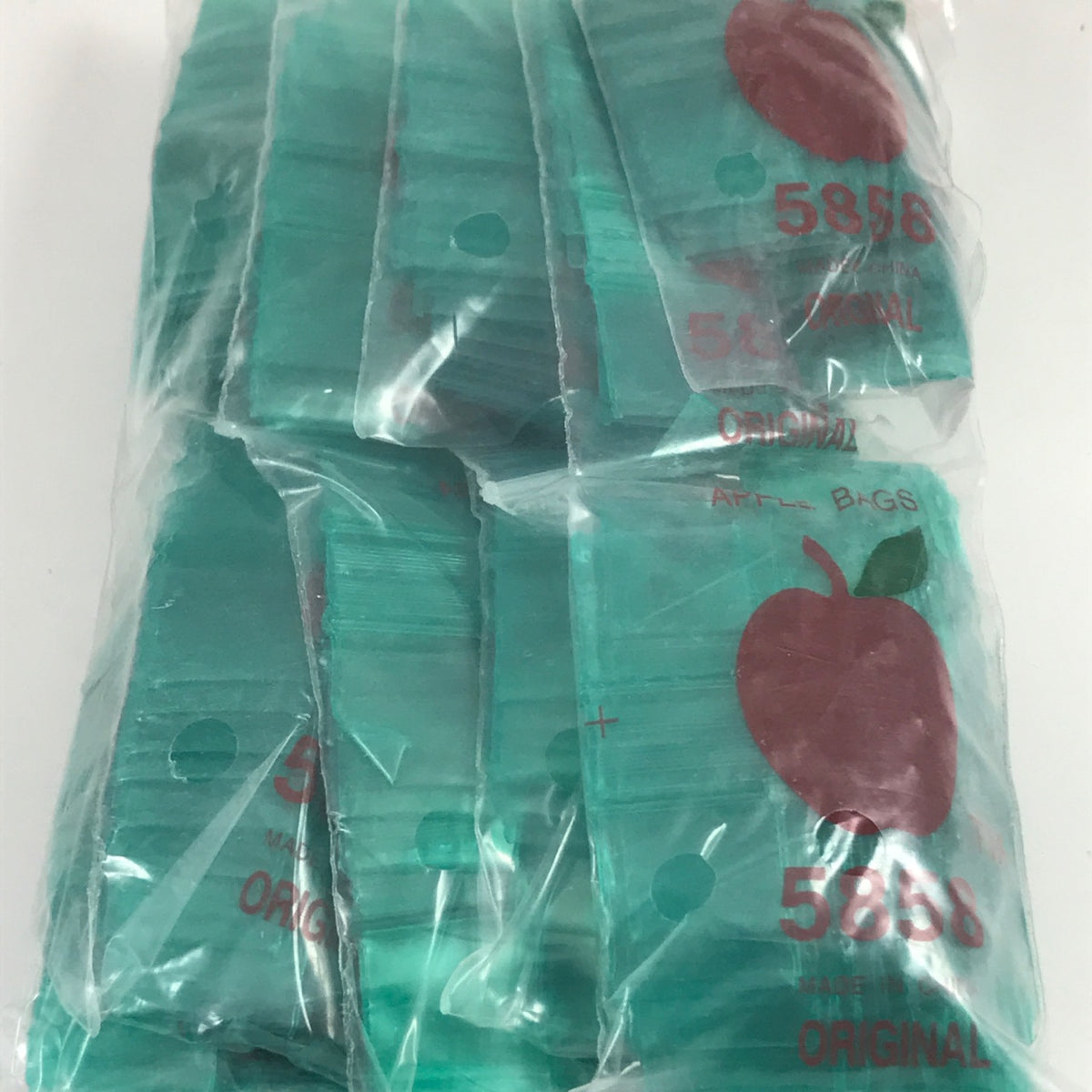 Green 5/8" x 5/8" resealable bags from Original Apple Bags, made of durable, eco-friendly material for secure storage.