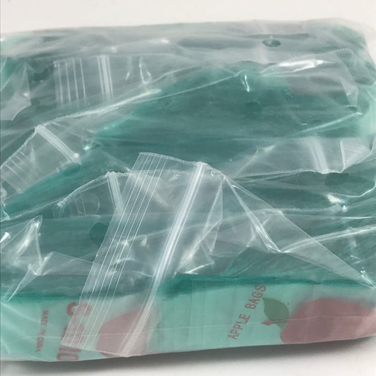 Green 1x1 inch resealable apple bags by Original Apple Bags, perfect for packaging small produce or snacks.