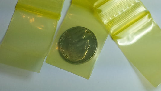 Yellow 1x1.5-inch resealable Original Apple Bags for storage or packaging, featuring the brand's classic design.