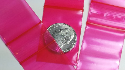 Red 1"x1.5" resealable bags from Original Apple Bags, perfect for small item storage and organization.