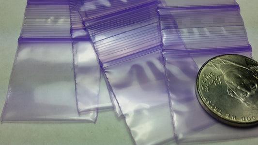 Purple 1x1.5-inch resealable bags by Original Apple Bags, ideal for packaging small items or gifts.