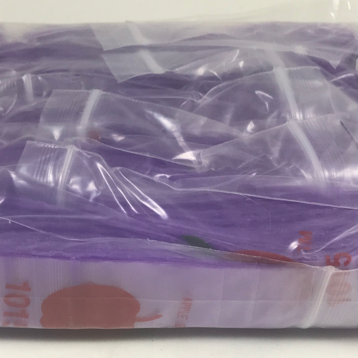 Purple 1x1.5-inch resealable bags from Original Apple Bags, showcasing their compact size and resealable closure.