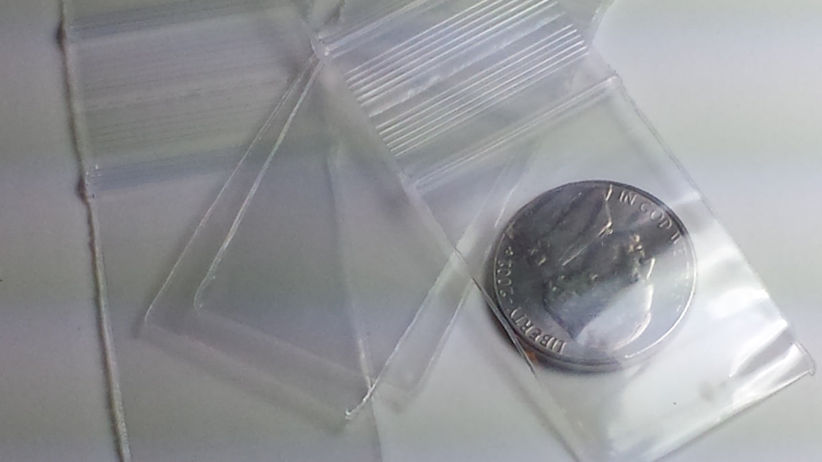 Clear resealable Apple Bags by Original Apple Bags, 1" x 1.5", shown in a close-up image.