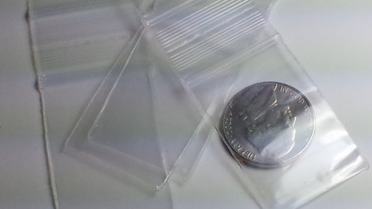 Clear resealable Apple Bags by Original Apple Bags, 1" x 1.5", shown in a close-up image.