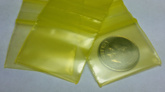 Yellow resealable Apple Bags by Original Apple Bags, 1.25" x 1", showing the colorful, resealable plastic bags for packaging.