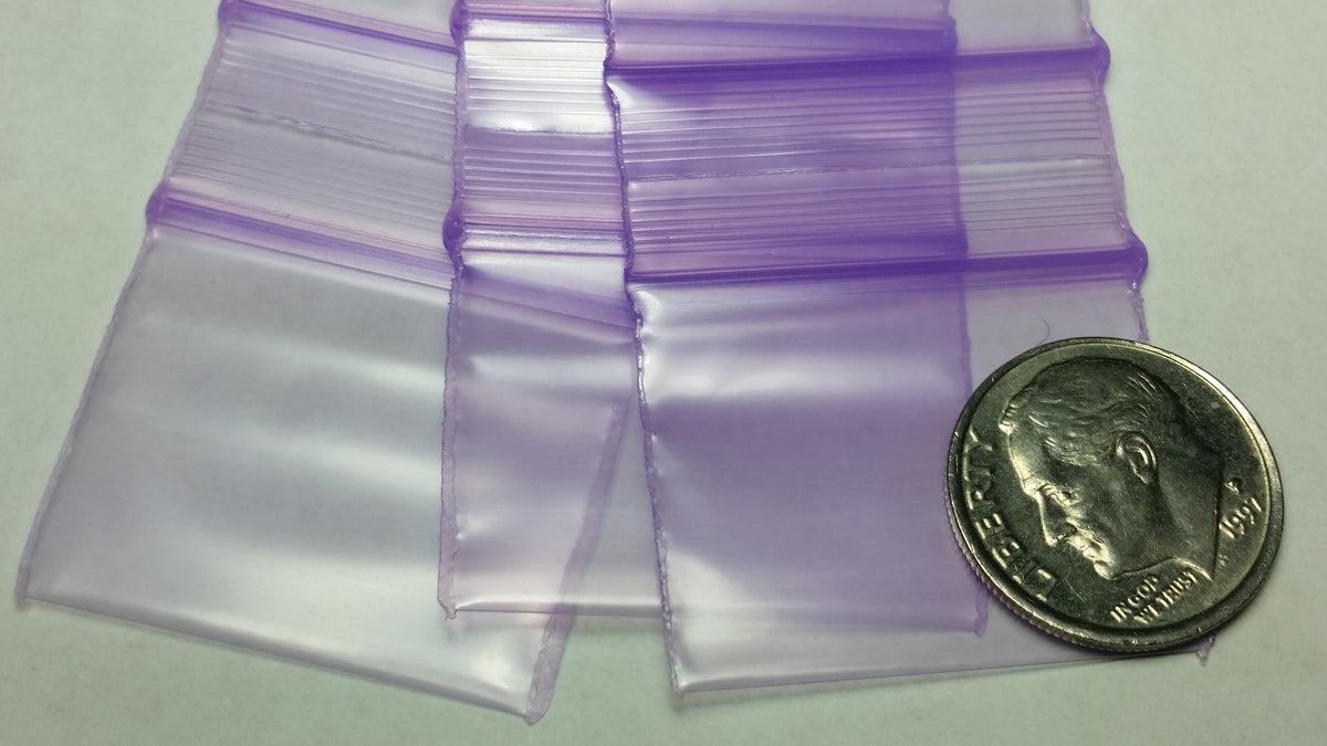 Purple resealable bags by Original Apple Bags, 1.25" x 1", ideal for storing small items or packaging.